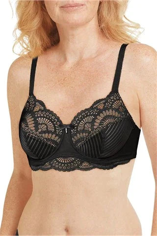 Woman wearing a black Amoena underwire mastectomy bra with lace detailing and striped cup design, shown from the waist up