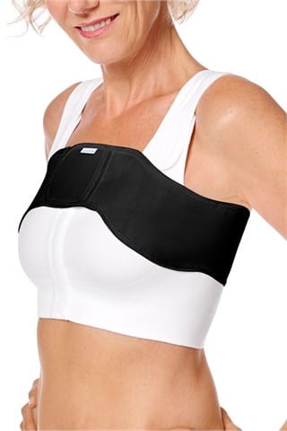 Amoena anatomical compression belt in black worn with surgical bra showing optimal positioning for recovery