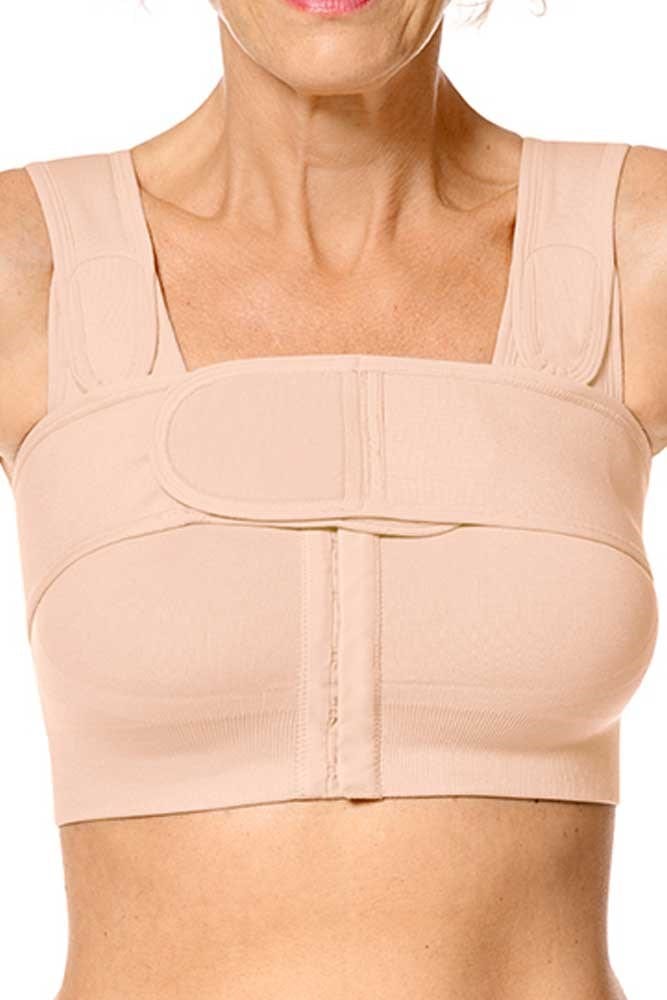 Amoena compression belt in rose nude worn over surgical bra demonstrating proper positioning for implant stabilization