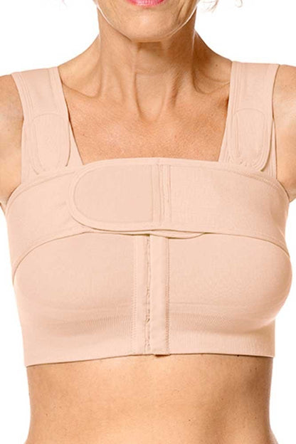 Amoena compression belt in rose nude worn over surgical bra demonstrating proper positioning for implant stabilization