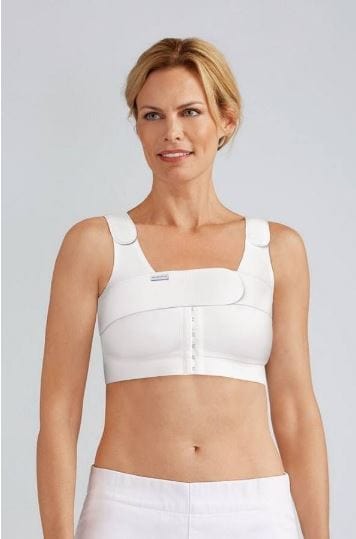 Amoena compression belt in white worn over surgical bra demonstrating proper positioning for implant stabilization