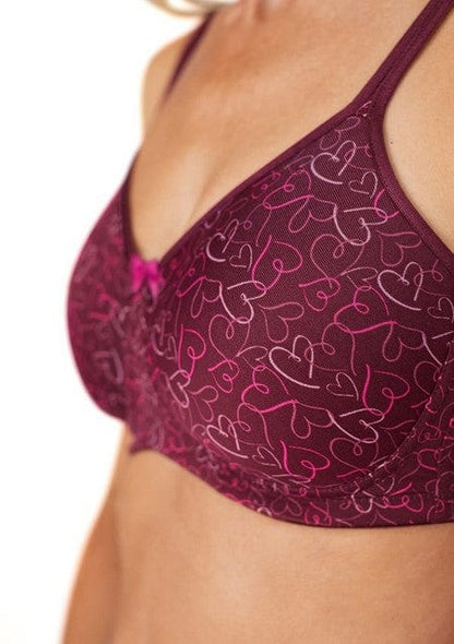Close-up of burgundy heart pattern fabric with bilateral pocket construction and breathable material